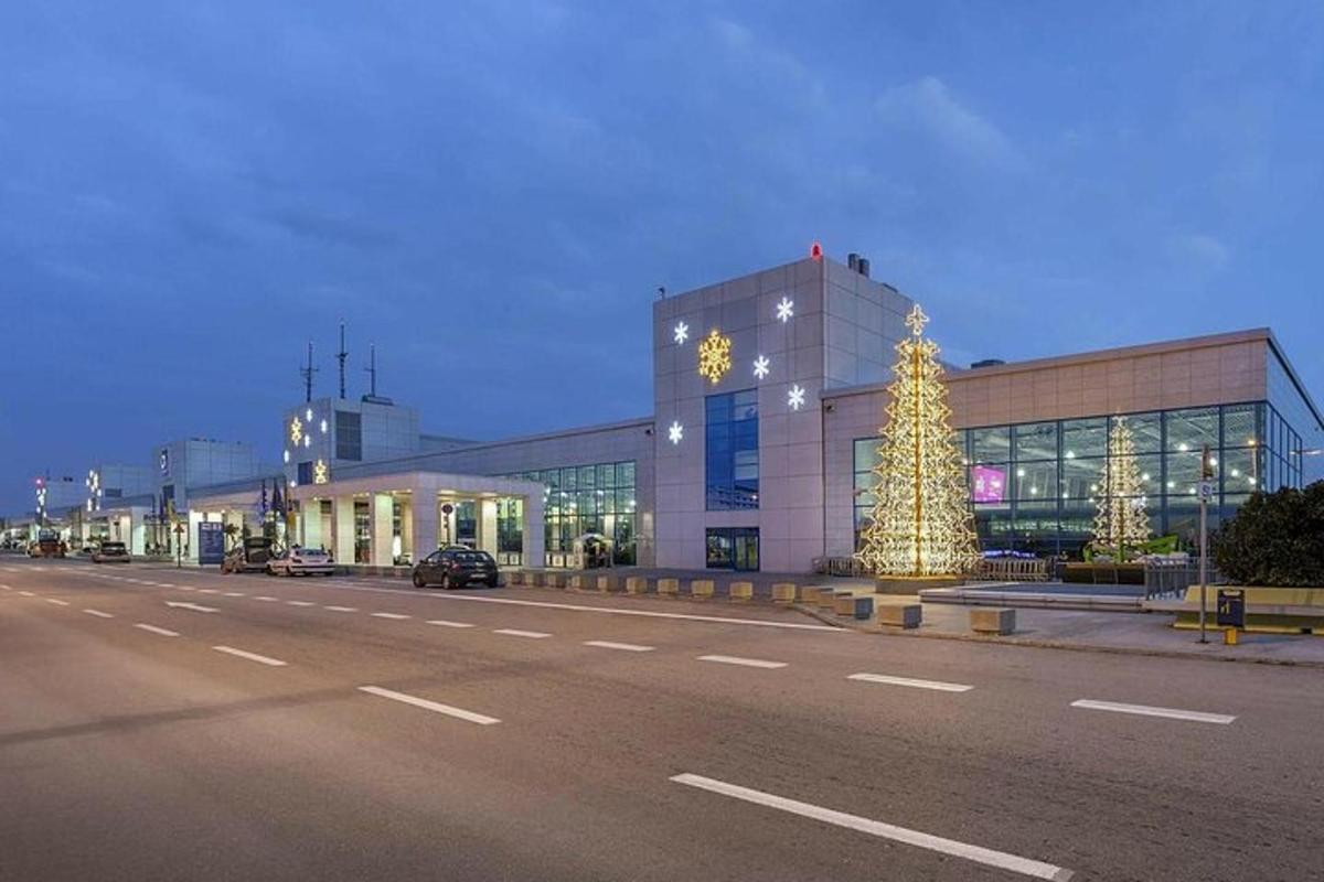 a building with a christmas tree in front of a street