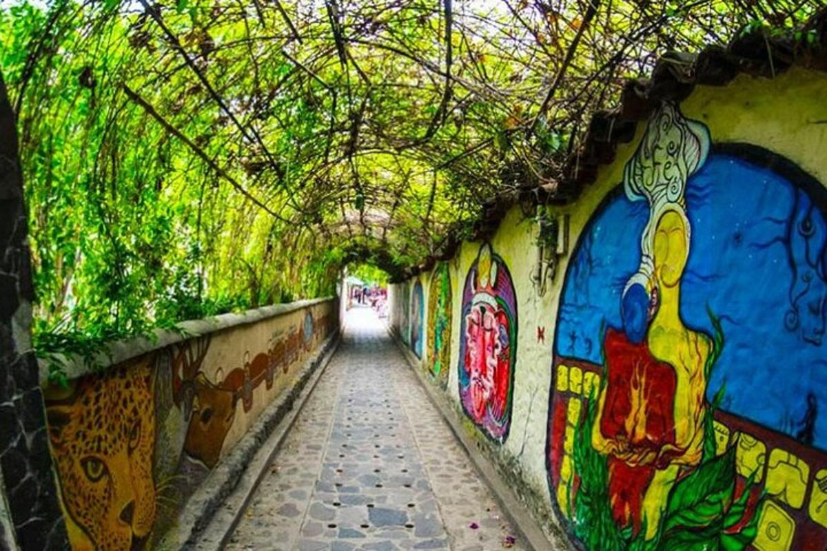 a tunnel with graffiti on the side of a building