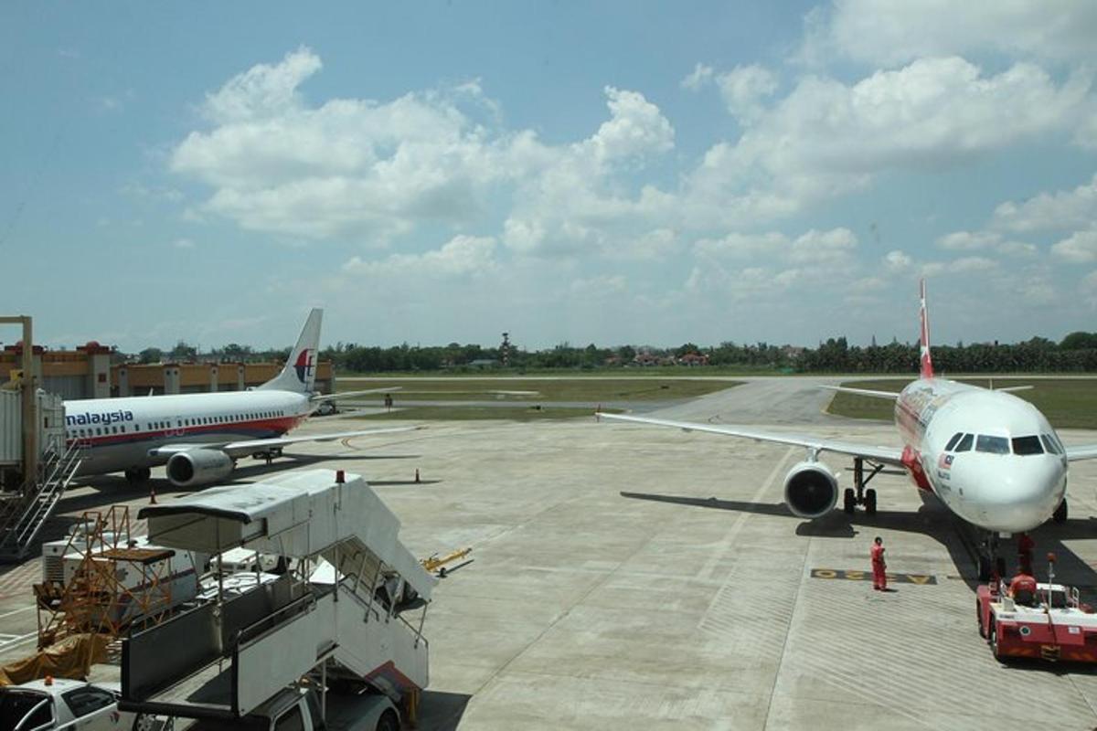 an airplane is parked on the runway at an airport