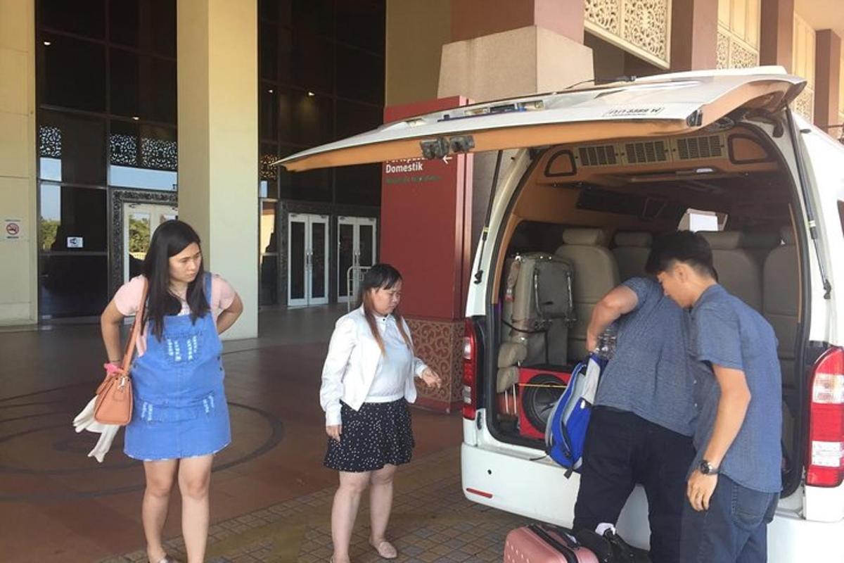 a group of people standing in front of a van