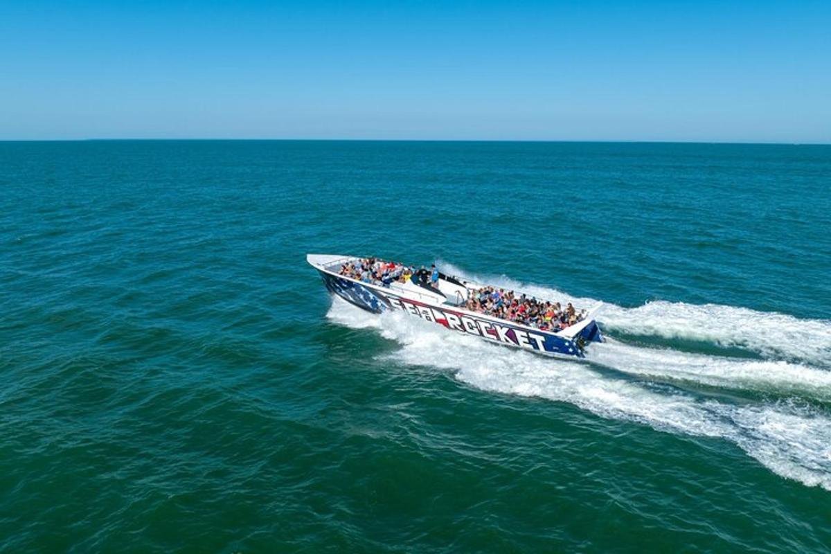 a group of people in a boat on the water