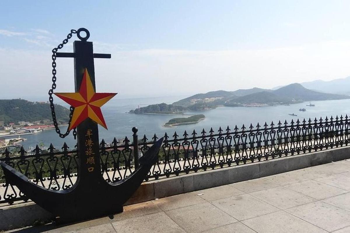 a statue of a ship with a star on a fence