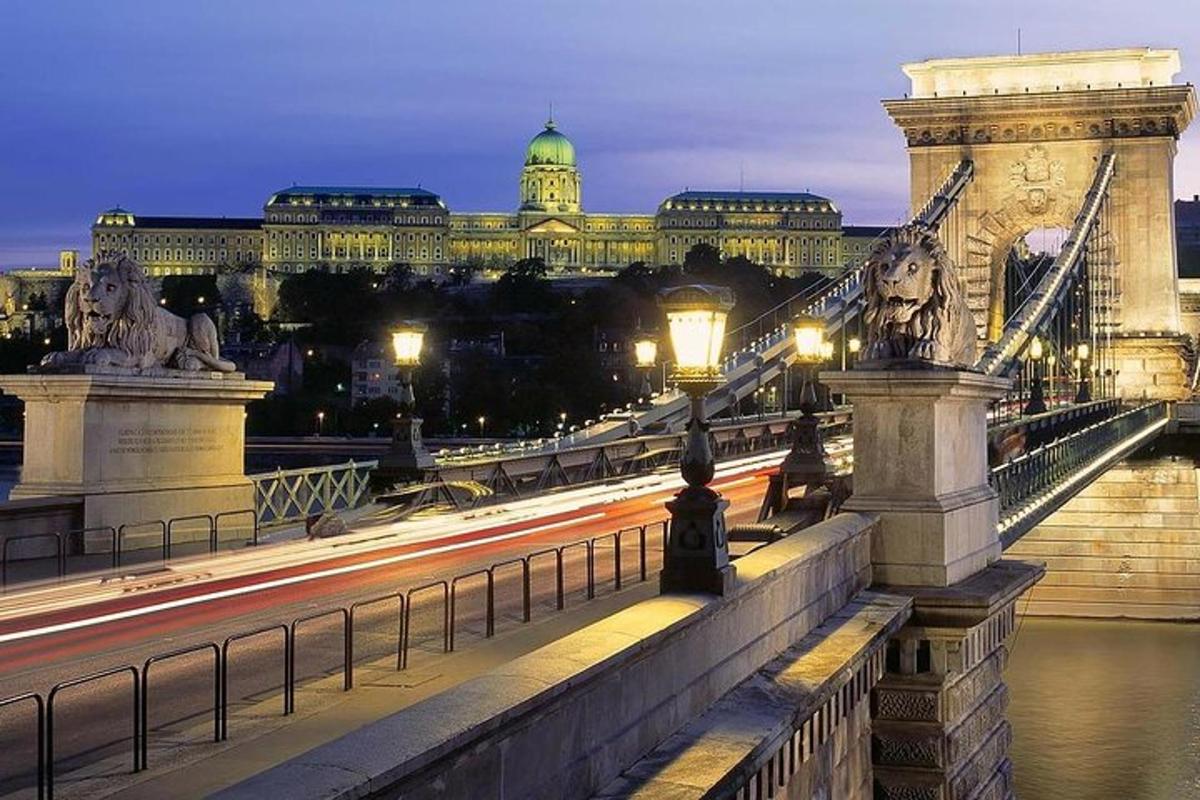 a bridge over a river with buildings in the background