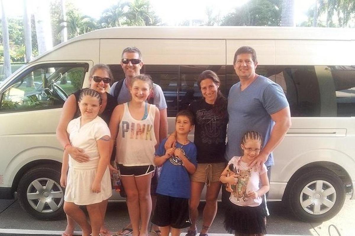 a group of people standing in front of a van