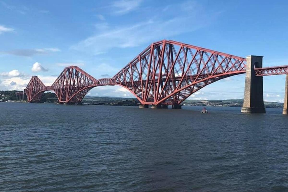 a large red bridge over the water