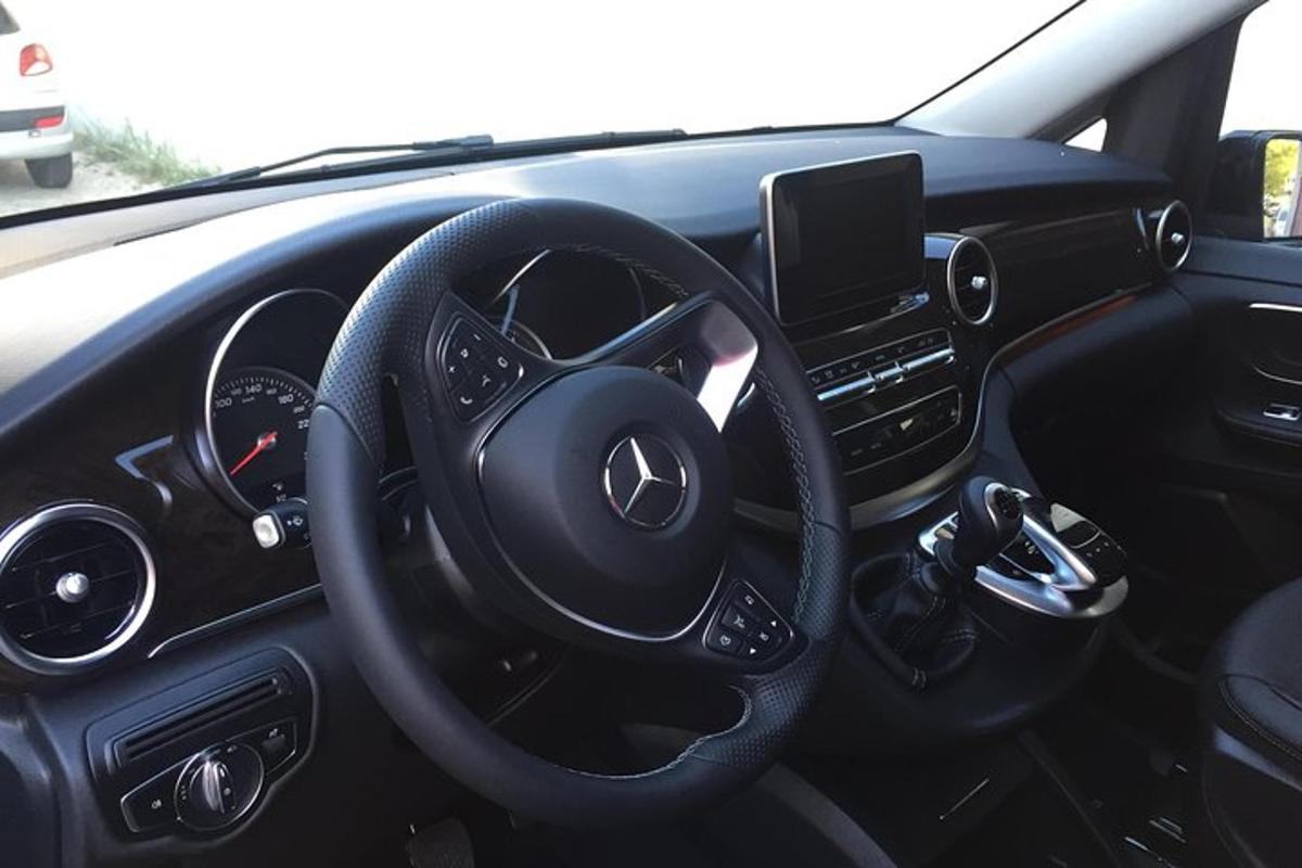 a view of the steering wheel of a car