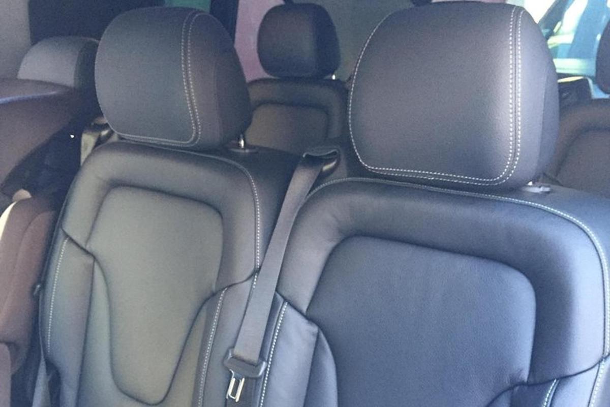 a group of seats in the back of a car