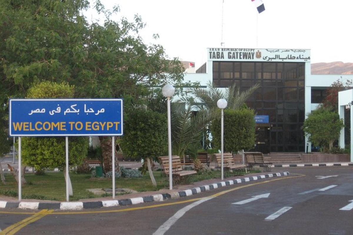 a blue welcome to jerusalem sign on the side of a street