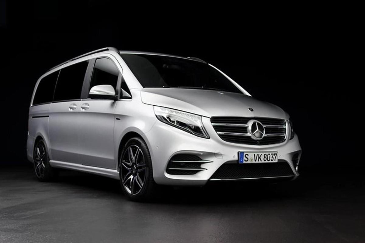 a white car parked in a dark room