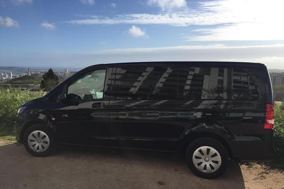 a black van parked on the side of a road