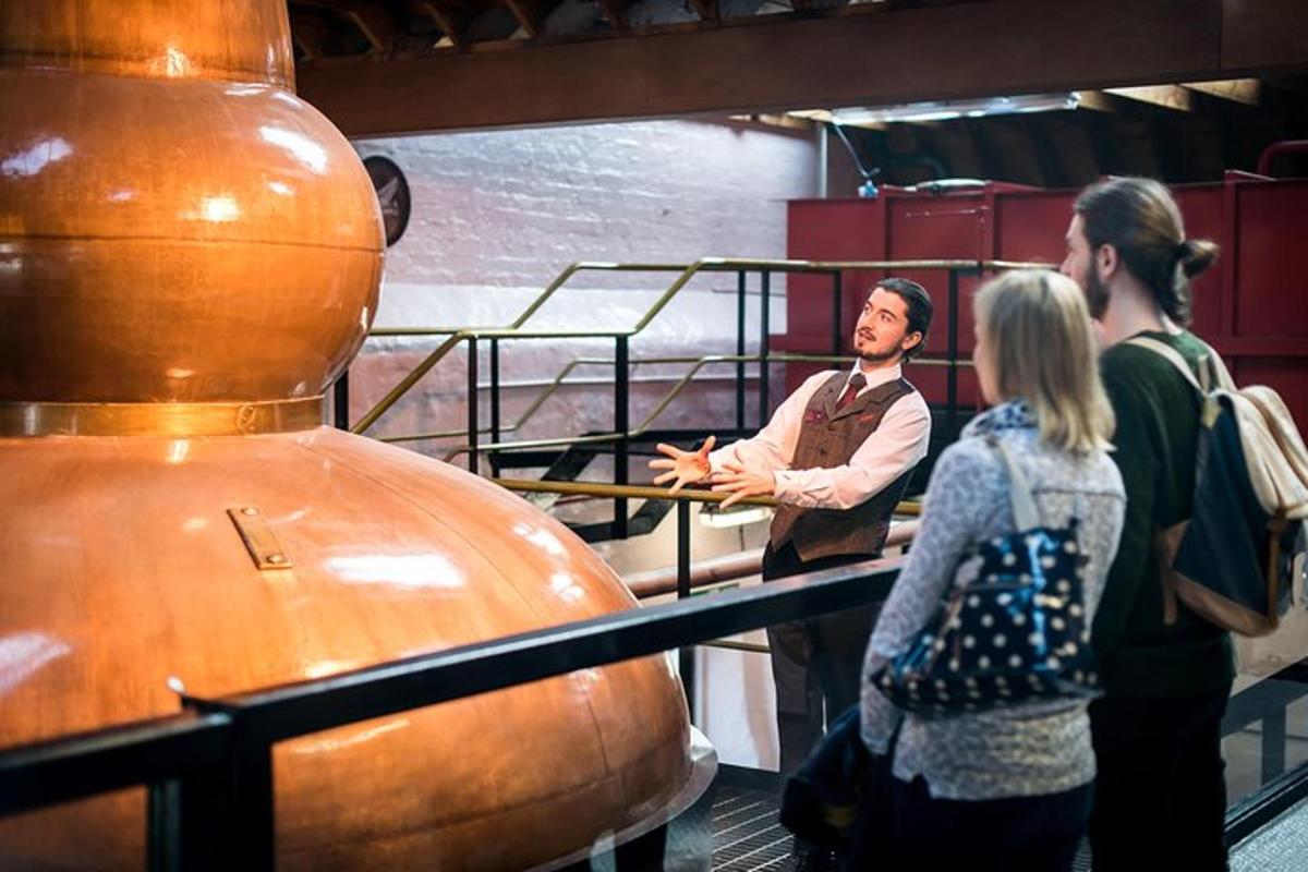 a man talking to a group of people in a museum