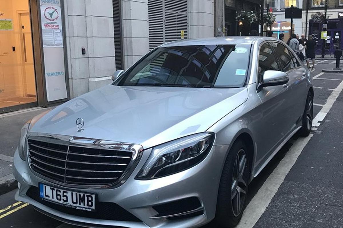 a silver car parked on the side of a street