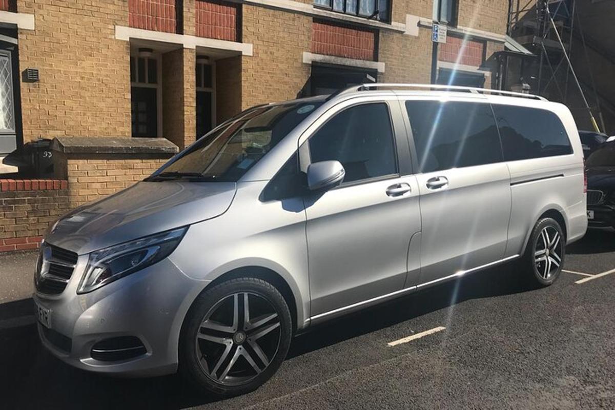 a silver van parked in a parking lot