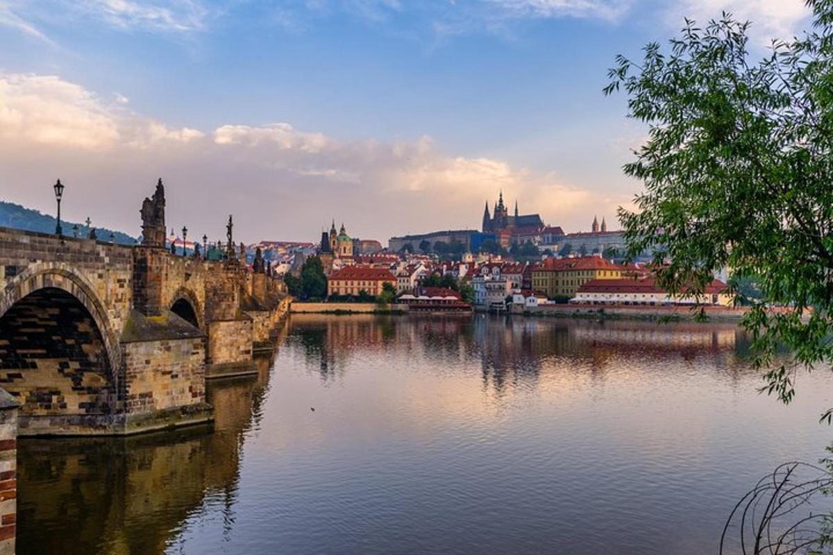 a bridge over a river with a city in the background