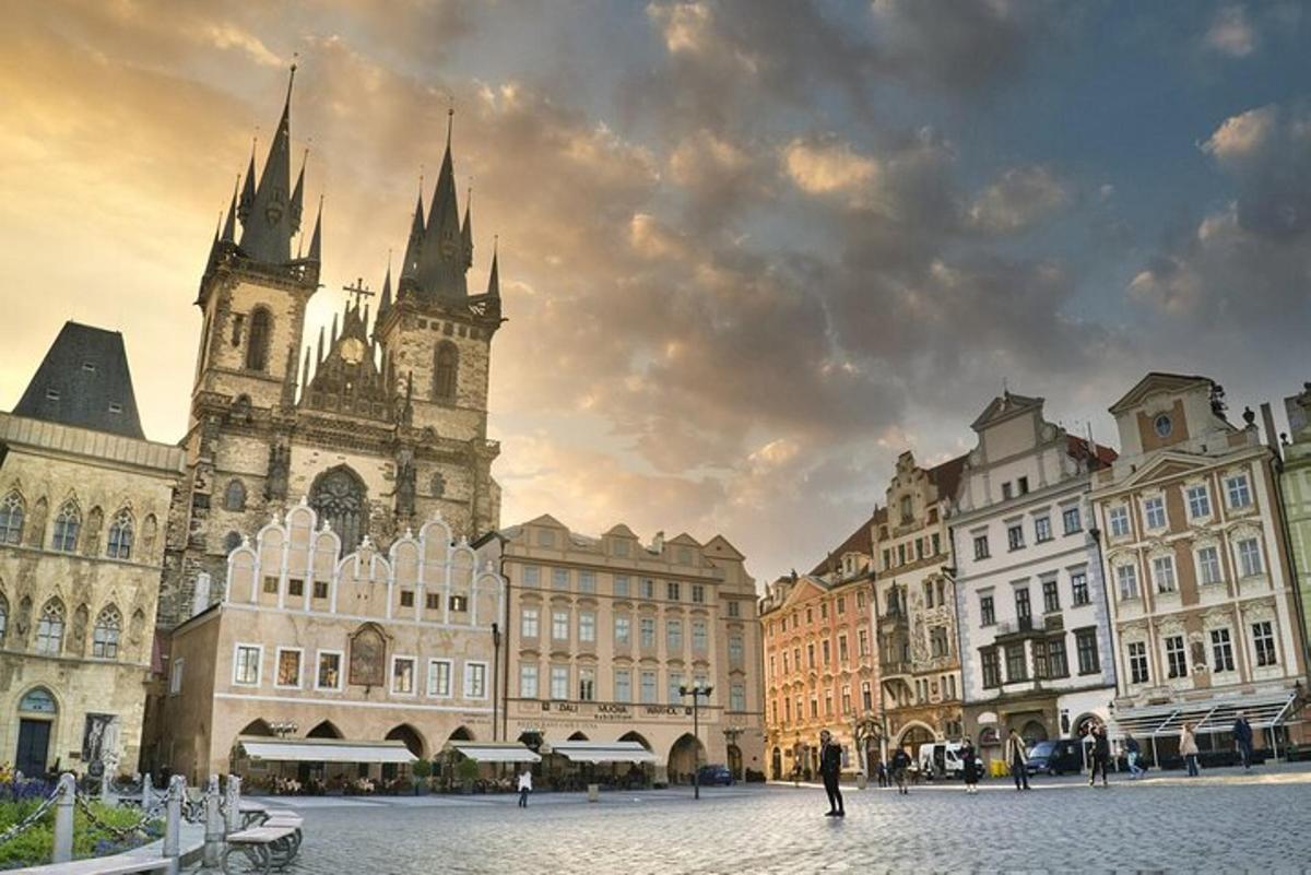 a group of buildings in a city with a cloudy sky