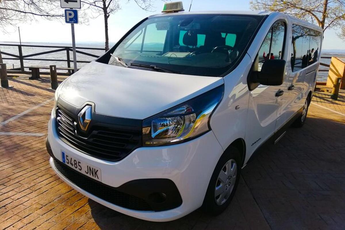 a white van parked next to a pier
