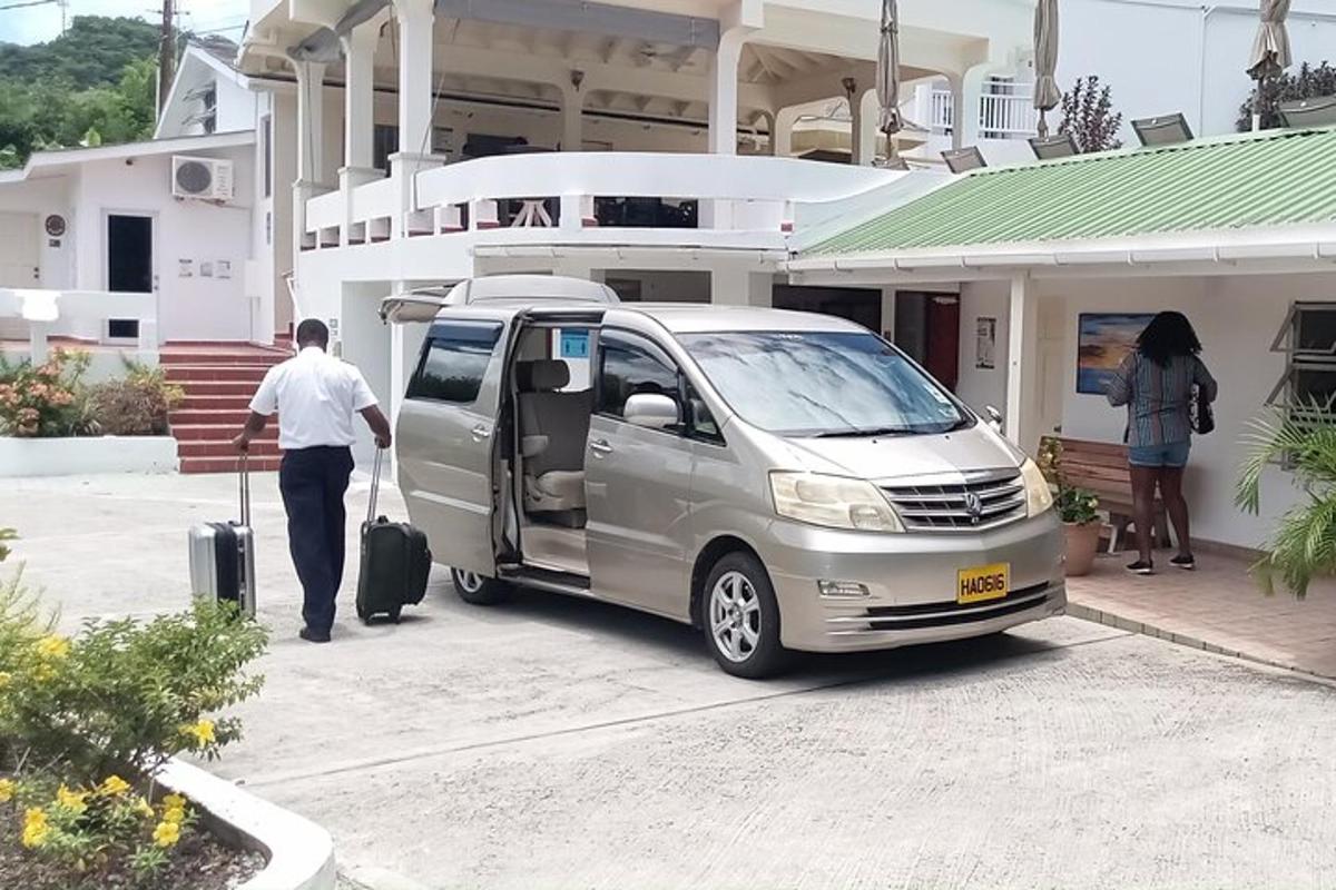 a man pulling his luggage out of a van