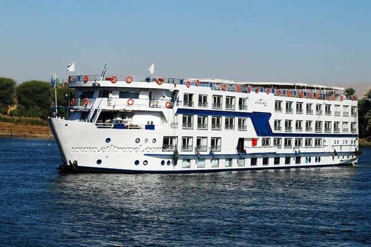 a large white cruise ship in the water