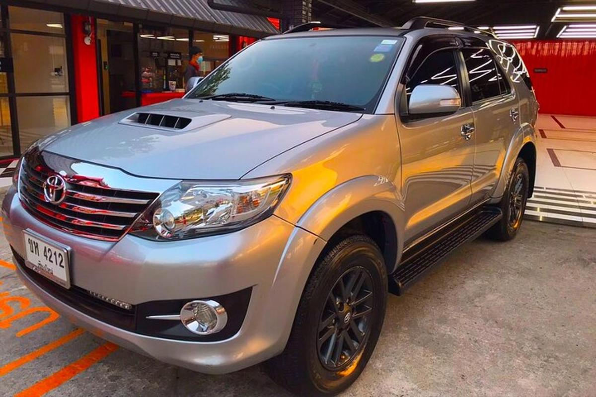 a silver suv parked in a parking lot