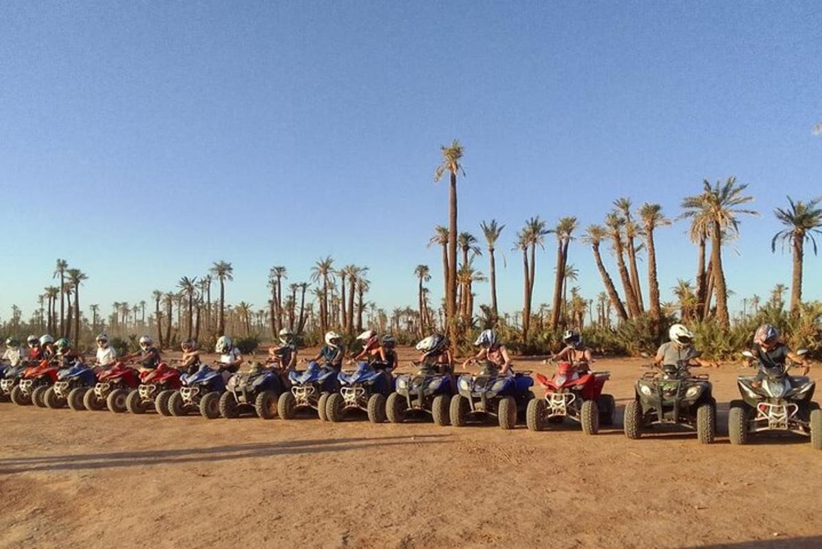 a group of people riding on quad bikes and atvs