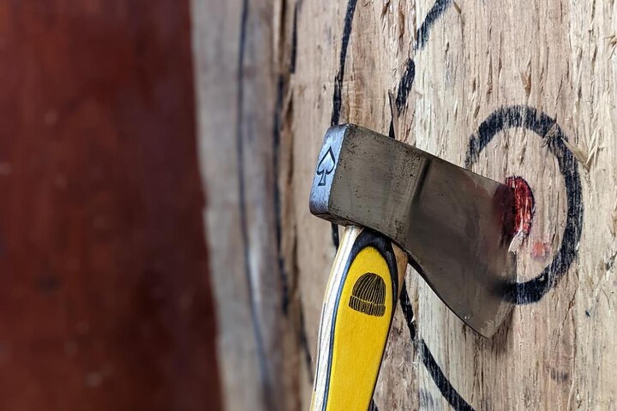 a knife sticking out of the side of a wooden wall
