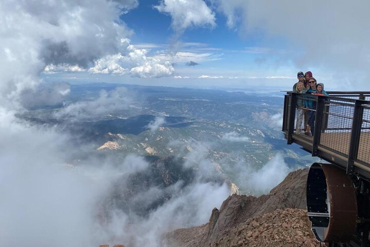 a group of people standing on top of a mountain
