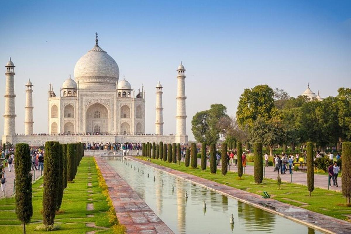 a view of the taj mahal with a pond in front of it