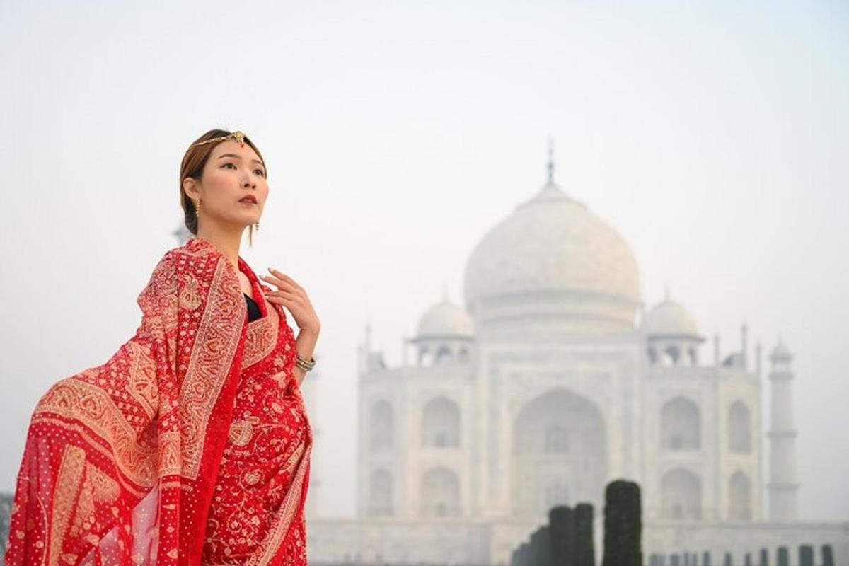 a woman in a red dress standing in front of a building