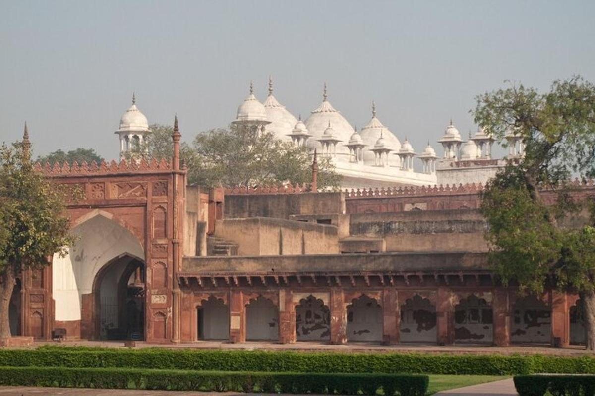 a large building with white domes on top of it