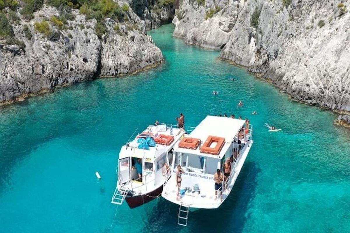 a boat in a body of water with people on it