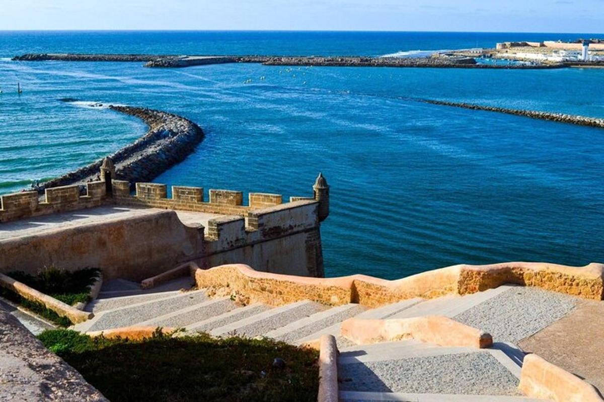a view of the ocean with stairs and the water