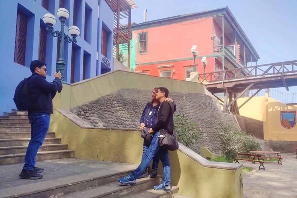 two people standing on the steps of a building