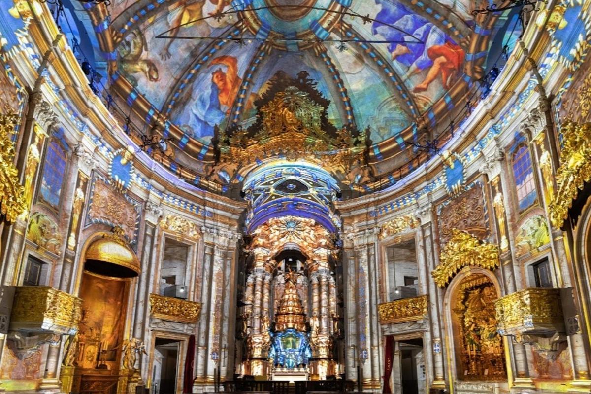 a large church with a ceiling with paintings on it