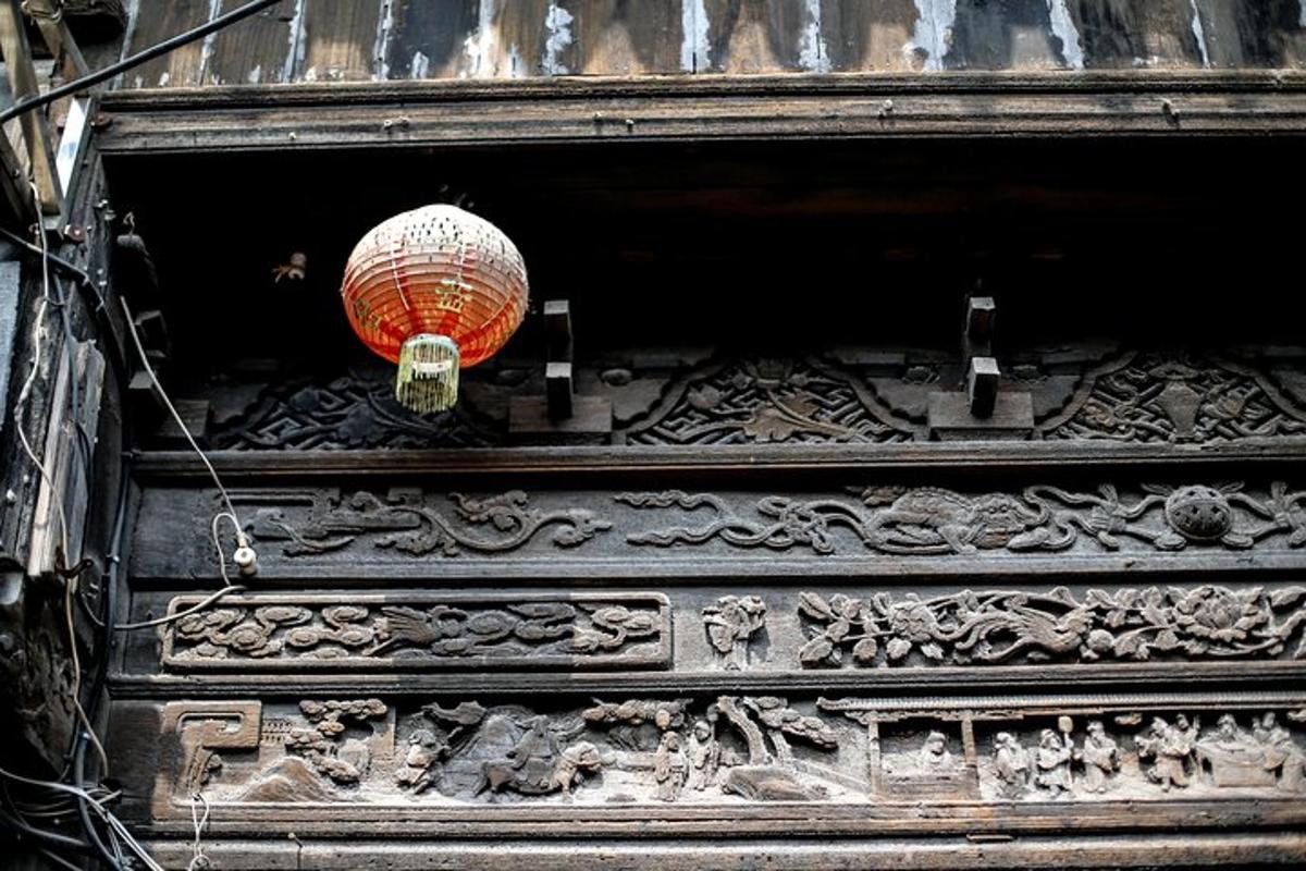 a chinese lantern is hanging from a building