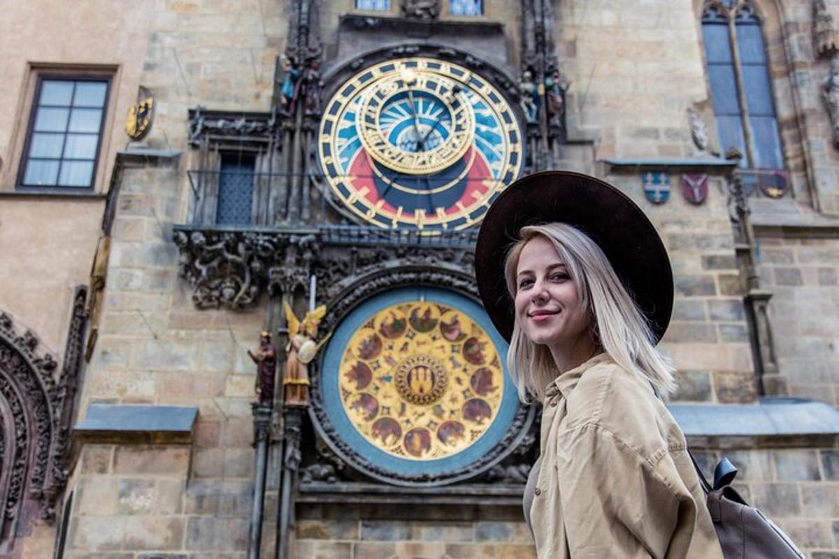 a woman standing in front of a clock tower