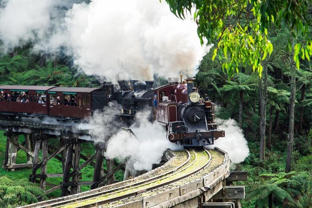 a steam train is coming down the tracks