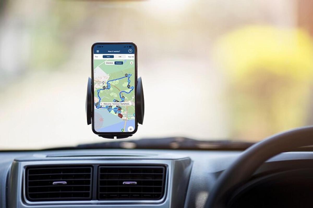 a cell phone sitting on the dashboard of a car