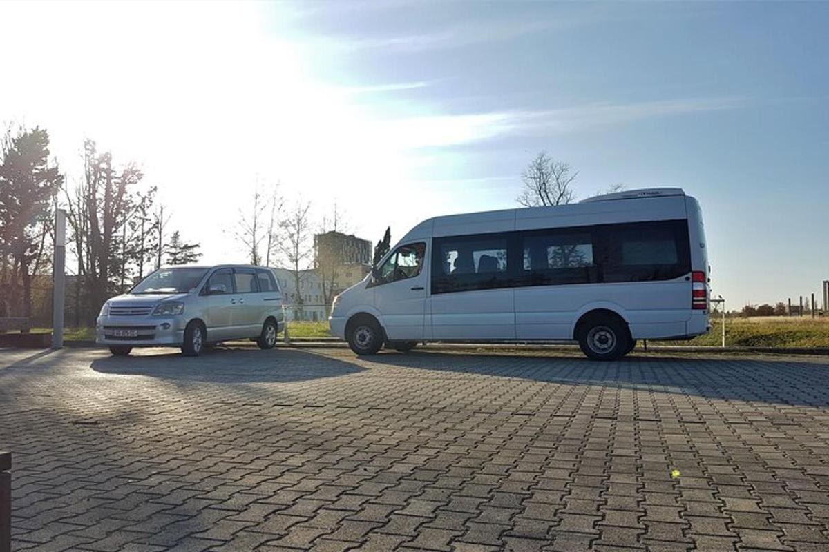 a white van and a white van parked in a parking lot