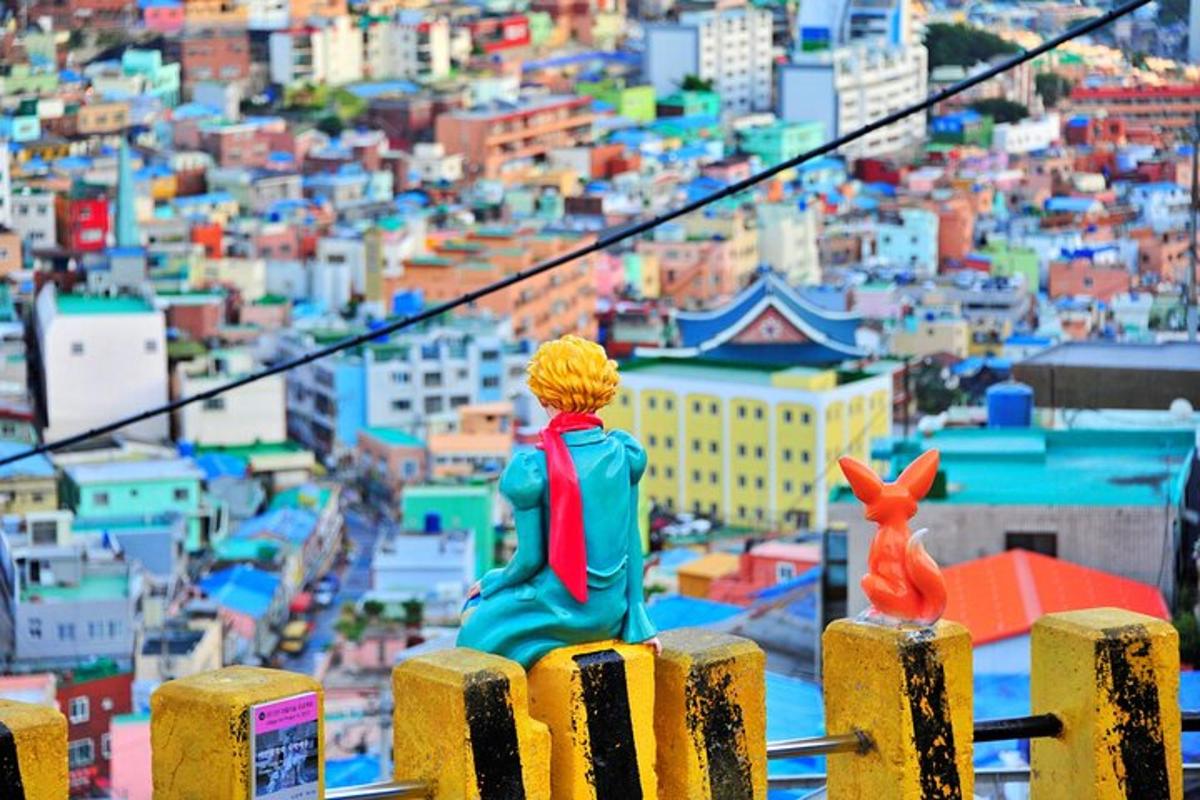 a figurine of a man and a rabbit sitting on top of a city