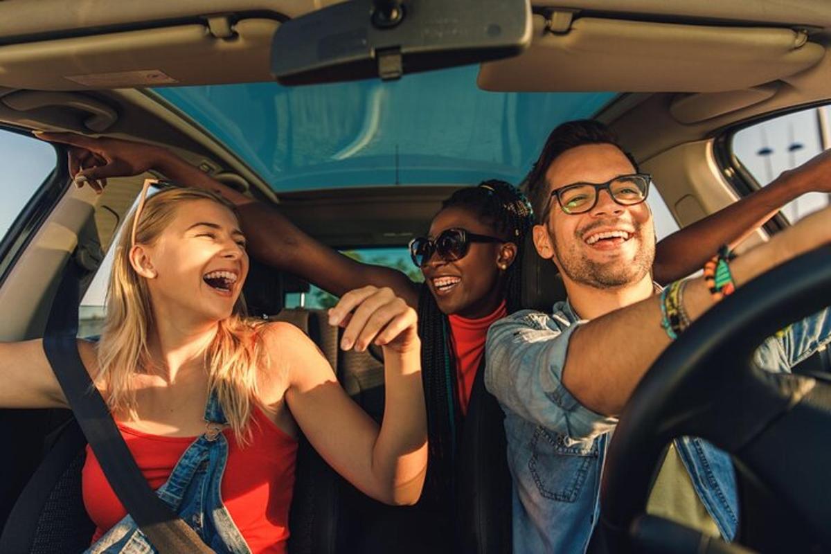 a group of people riding in a car