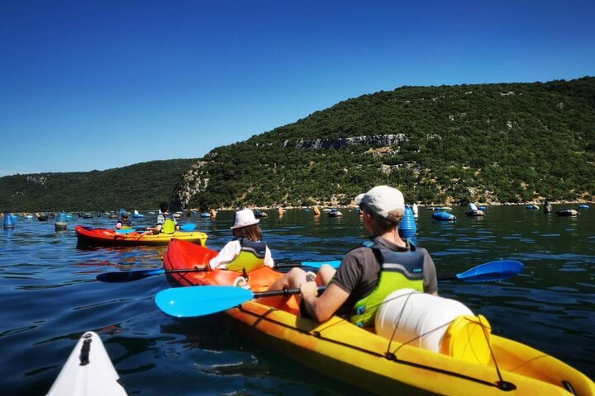 two people in kayaks on a body of water