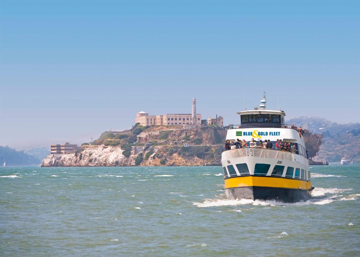 a yellow and white boat in the water