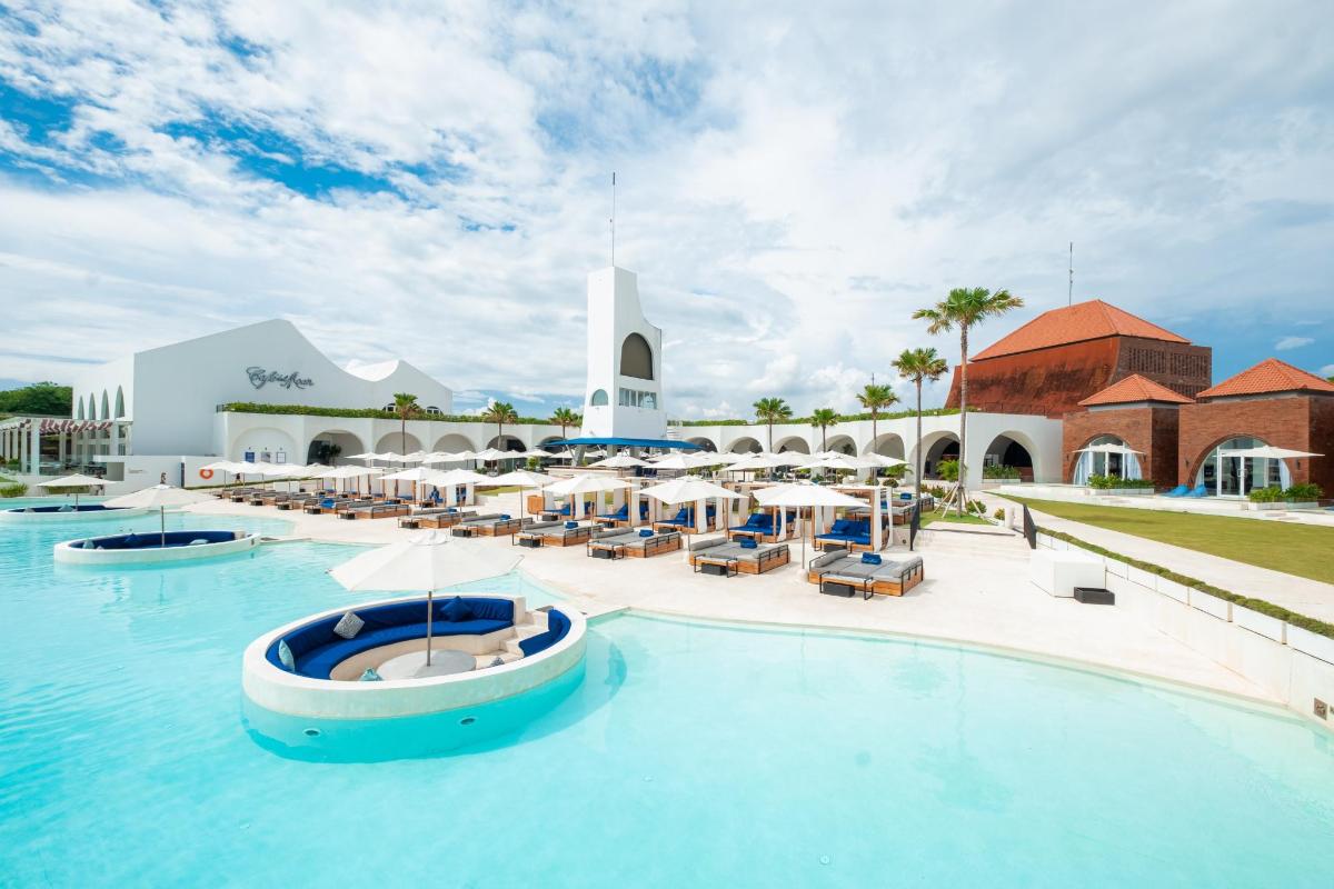 a resort with a pool with a boat in it