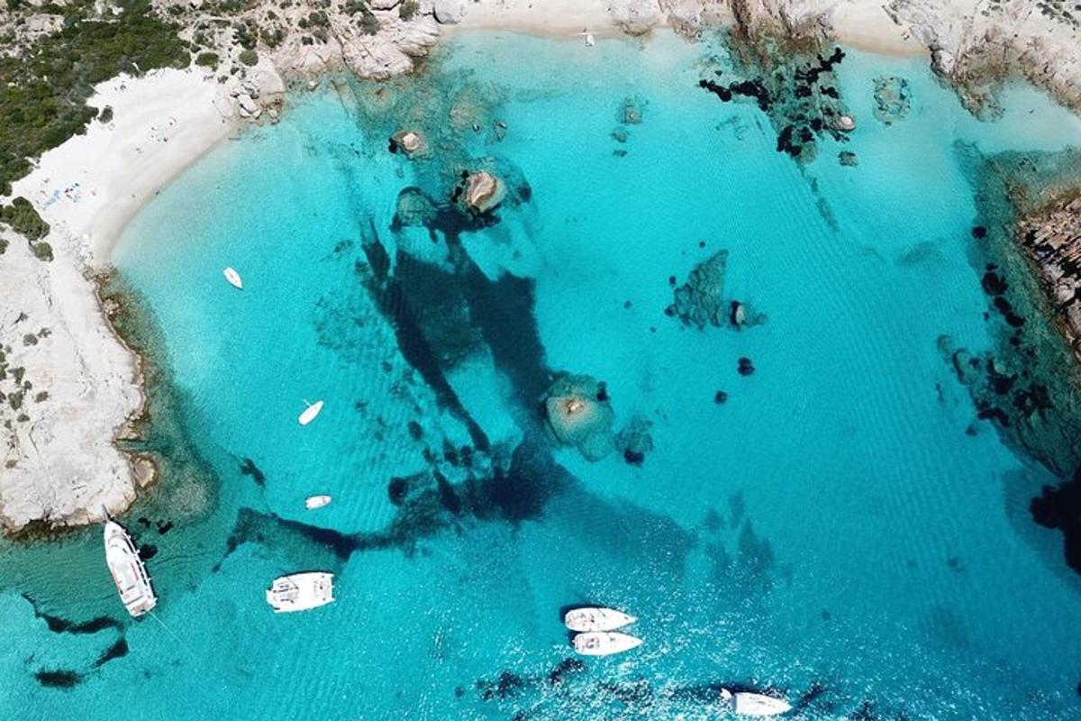an aerial view of a pool of blue water