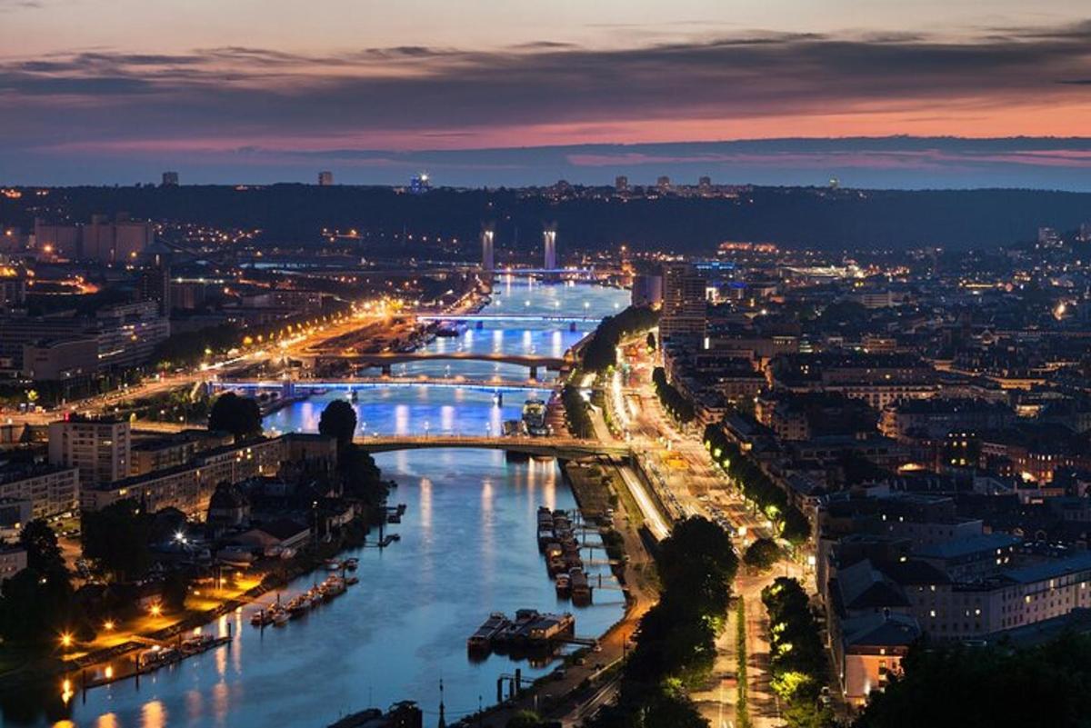 a view of a river with a city at night