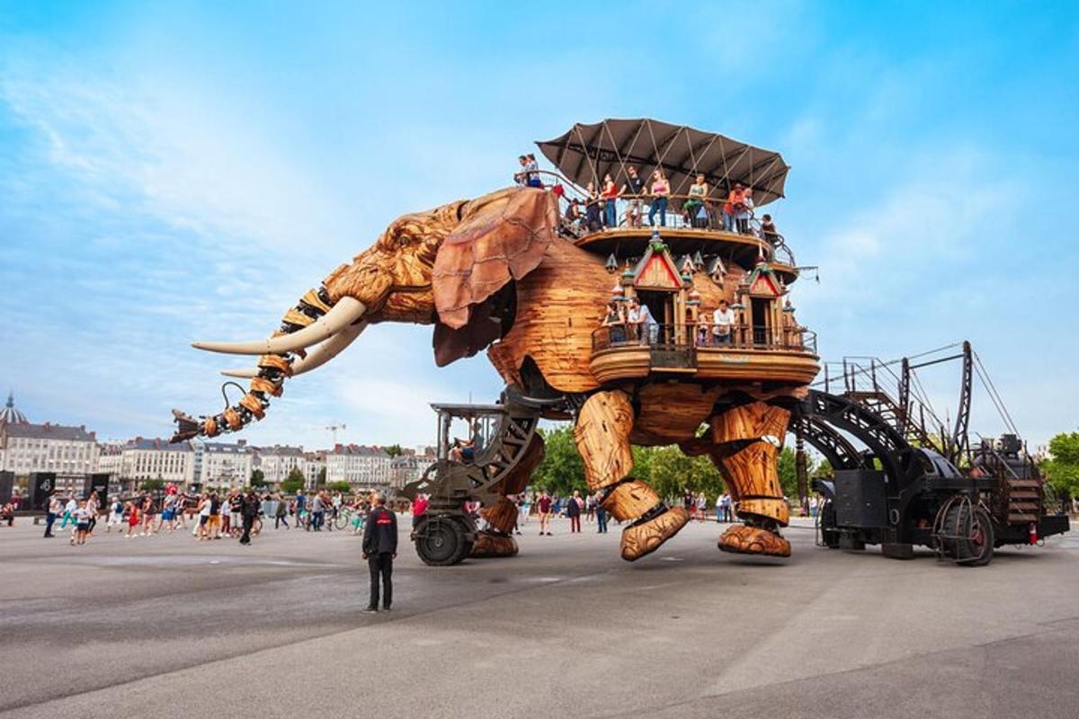 a float of an elephant with people riding on its back
