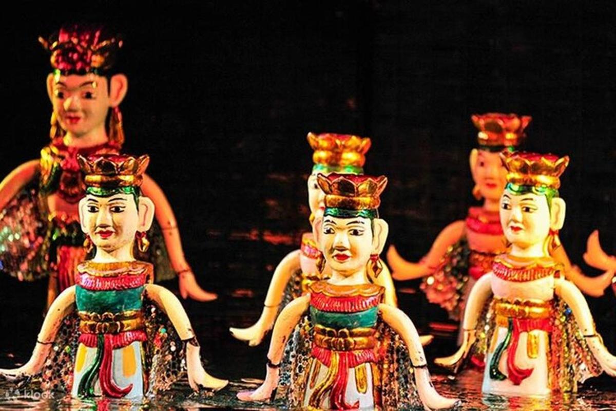four chinese dolls are standing on a table