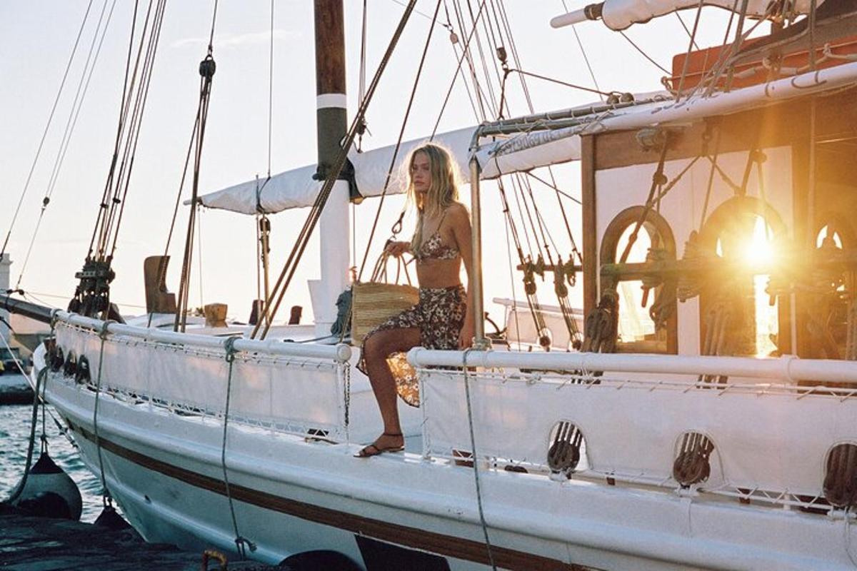 a woman sitting on a boat in the water