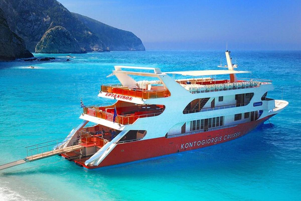 a cruise ship in the water near a beach