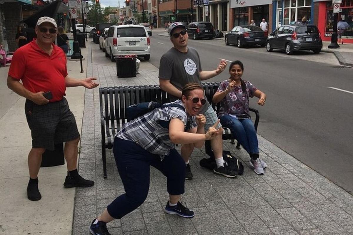 a group of people sitting on a bench on a street